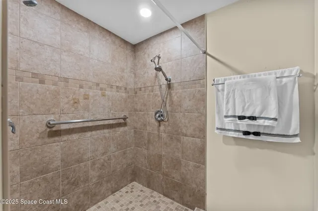 a view of storage and utility room with racks on the wall