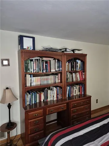 a bedroom with bed and window