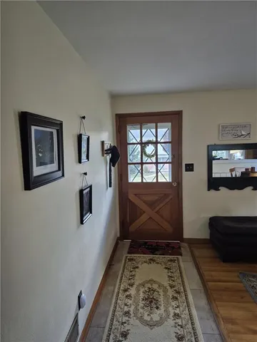 a kitchen with granite countertop wooden cabinets stainless steel appliances and a window