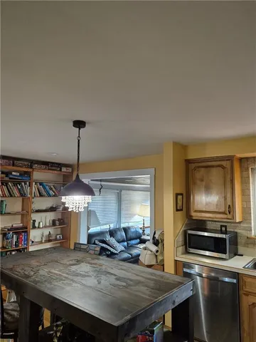 a bathroom with a shower and a window