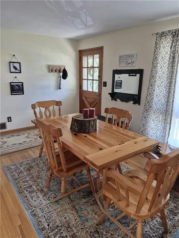 a living room with furniture a window and a flat screen tv