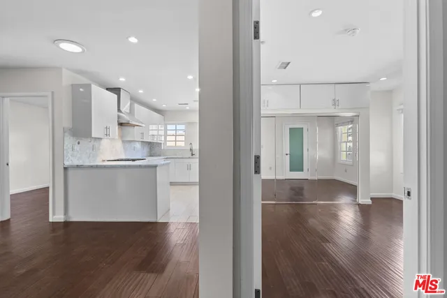 a view of kitchen with wooden floor