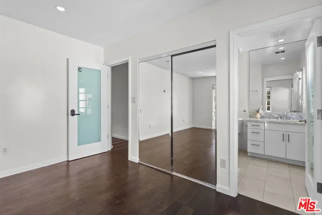 a bathroom with a shower and a sink
