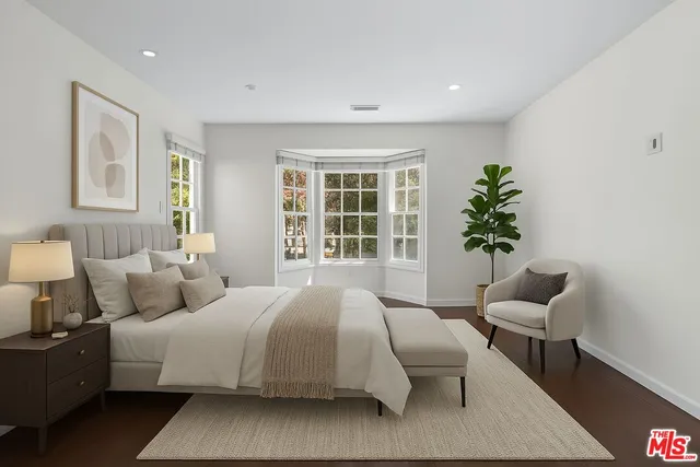 a bedroom with a bed and window