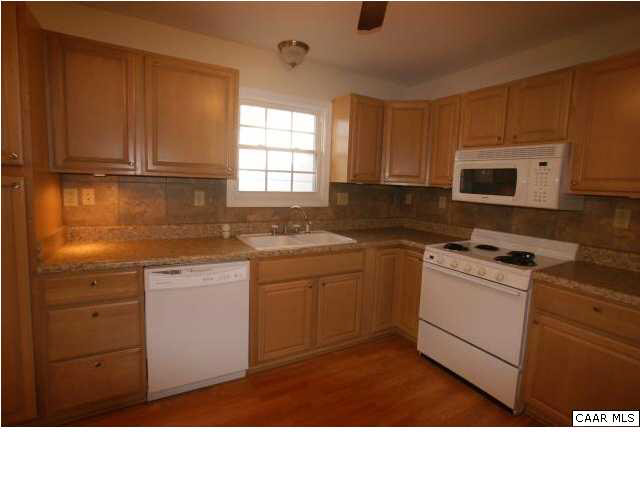 614 Shamrock Road Charlottesville, VA 22903 - Photo 3 of 13 Updated kitchen with maple cabinets, tile backsplash and hardwood floors