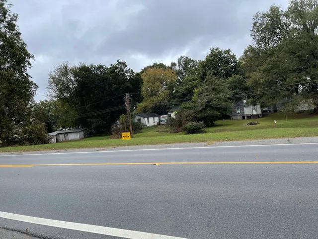 a view of a swimming pool and a yard