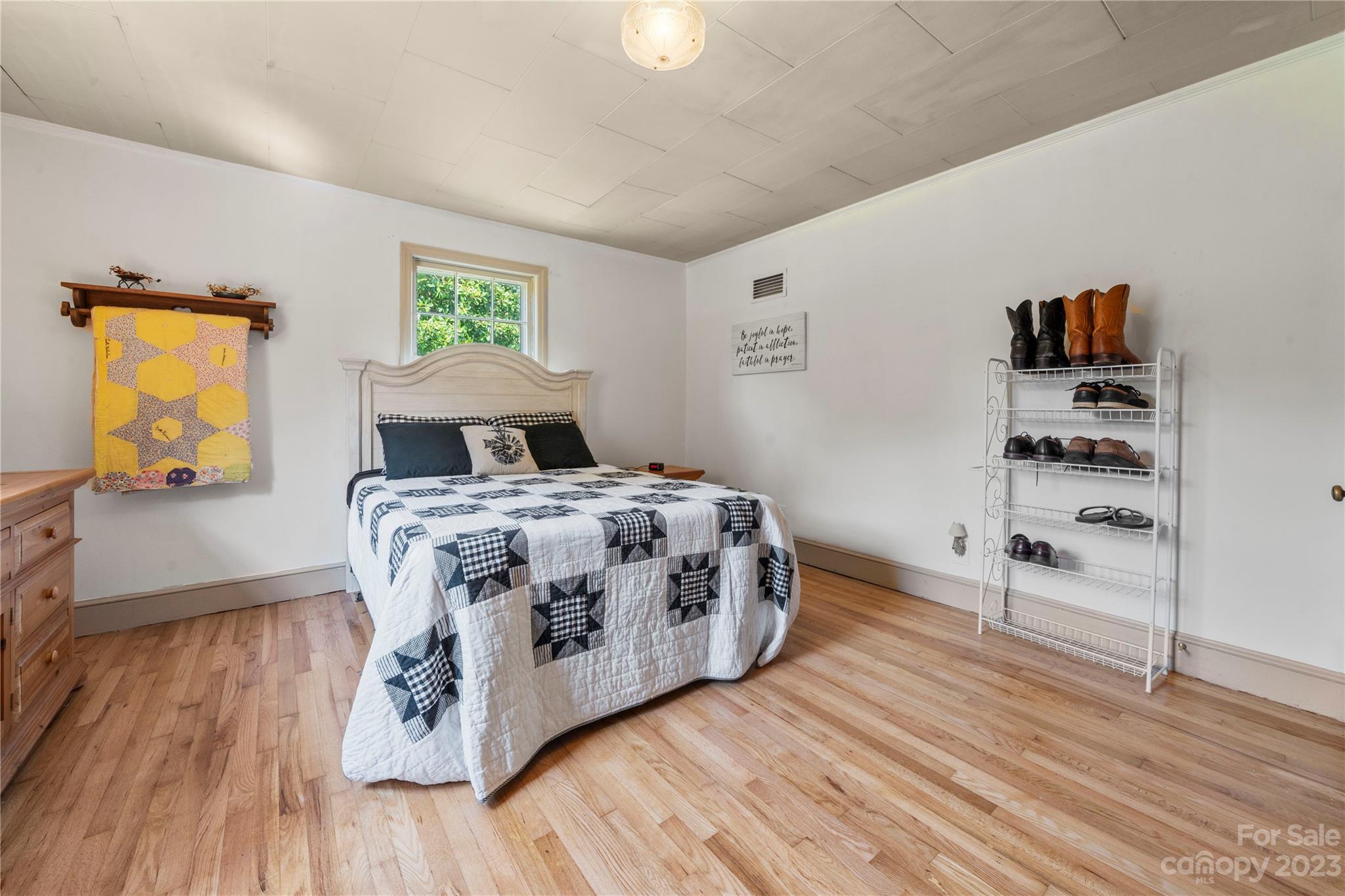 818 Old Buncombe Road Union, SC 29379 - Photo 19 of 27 a bedroom with a bed and wooden floor