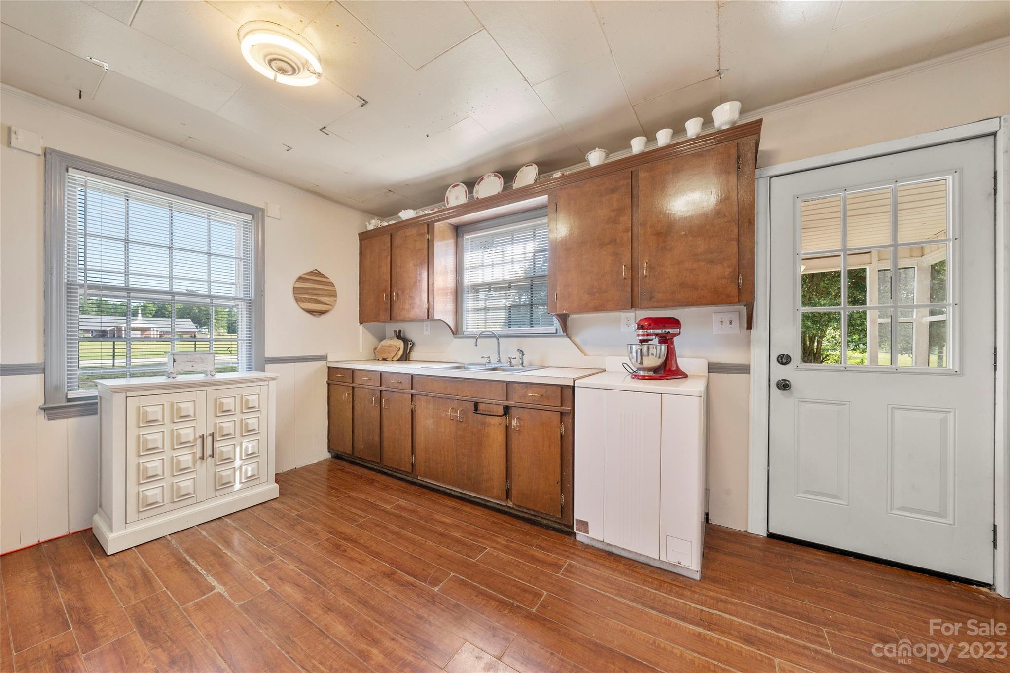 818 Old Buncombe Road Union, SC 29379 - Photo 3 of 27 a kitchen with a sink cabinets wooden floor and a window