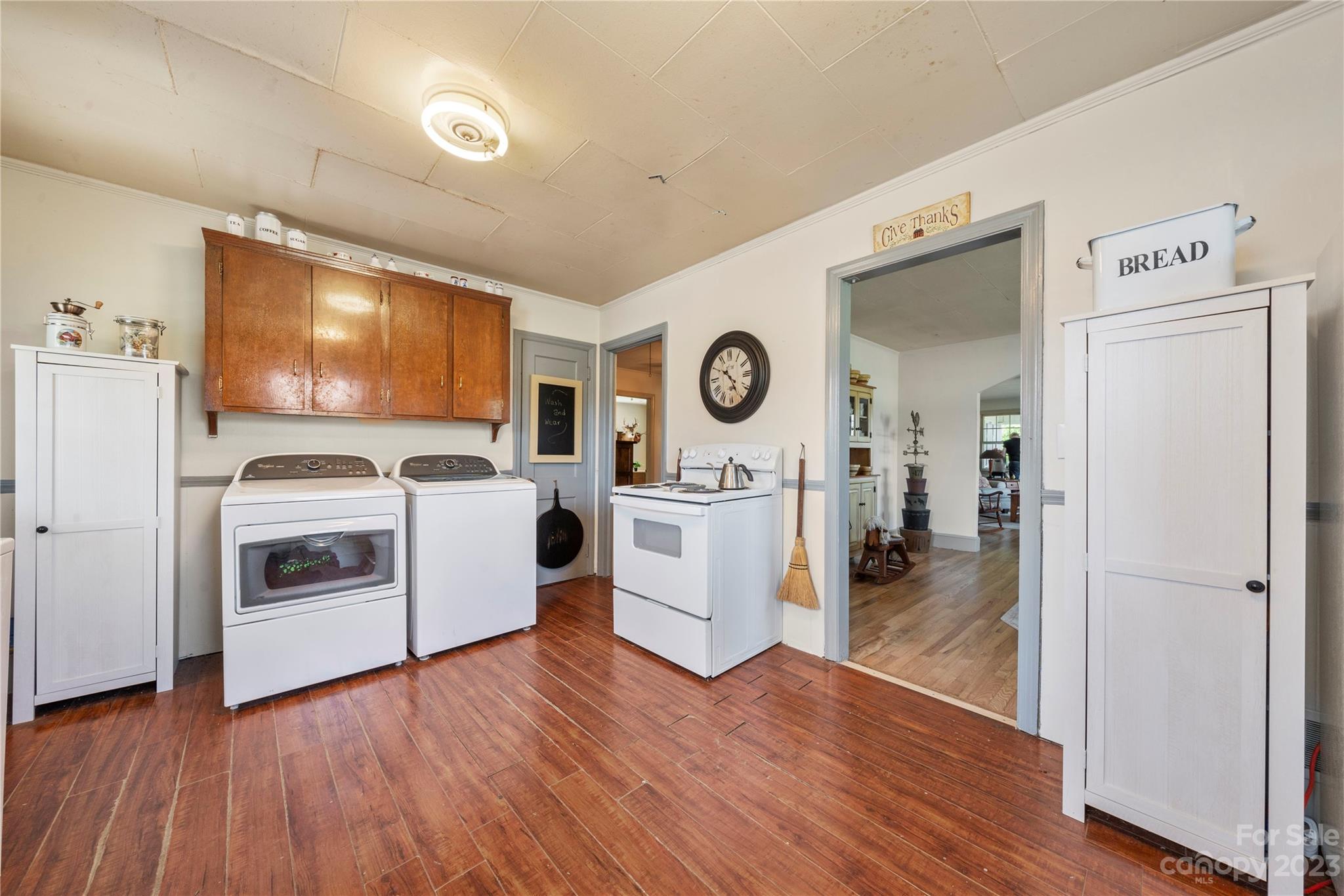 818 Old Buncombe Road Union, SC 29379 - Photo 4 of 27 a kitchen with a refrigerator stove and wooden floor