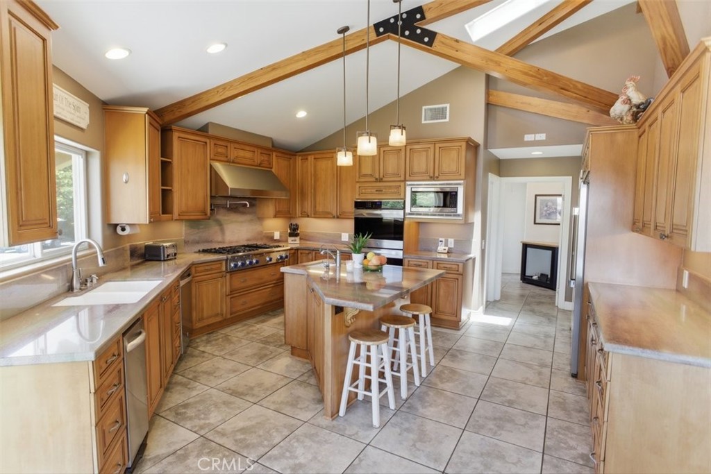 31233 Romero Canyon Road Castaic, CA 91384 - Photo 13 of 38 a kitchen with a sink cabinets and counter space
