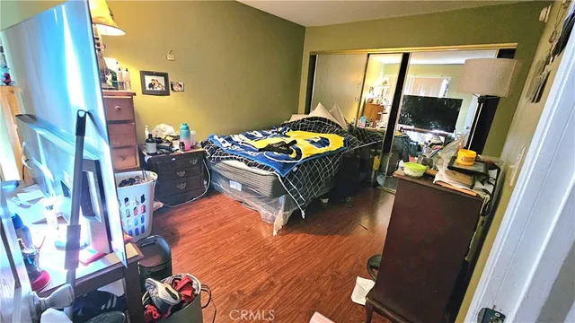 a bed room with a bed and a mirror