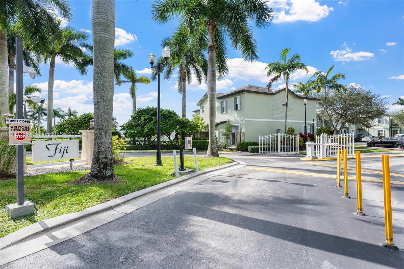 230 Southeast 29th Avenue, Unit 21 Homestead, FL 33033 - Photo 2 of 34 a view of a swimming pool with a lawn chairs and palm trees