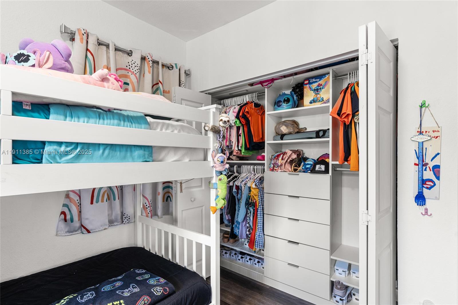 230 Southeast 29th Avenue, Unit 21 Homestead, FL 33033 - Photo 23 of 34 a view of walk in closet with clothes and shoes