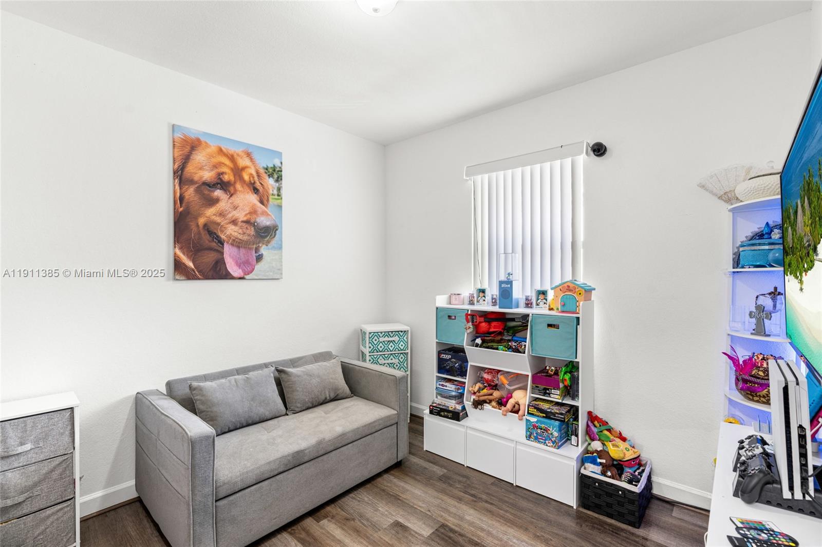 230 Southeast 29th Avenue, Unit 21 Homestead, FL 33033 - Photo 24 of 34 a living room with furniture and a window