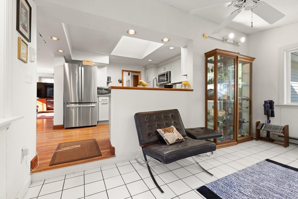 109 Riverview Road Gloucester, MA 01930 - Photo 20 of 42 a living room with furniture rug and a chandelier