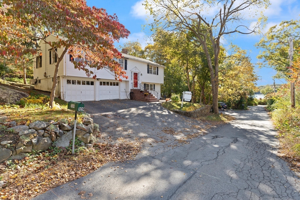 109 Riverview Road Gloucester, MA 01930 - Photo 2 of 42 a view of a chairs in a backyard