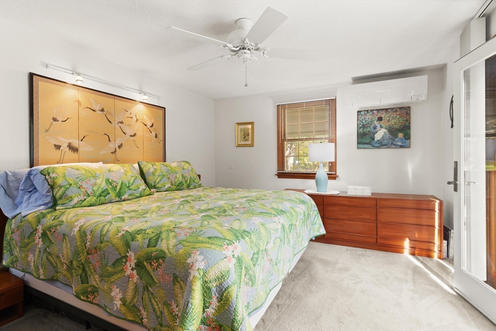 109 Riverview Road Gloucester, MA 01930 - Photo 26 of 42 a bedroom with a bed and a painting on the wall