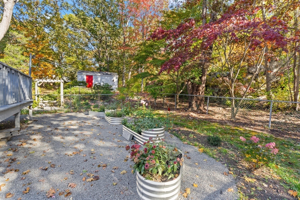 109 Riverview Road Gloucester, MA 01930 - Photo 36 of 42 a sign that is sitting in the middle of the garden