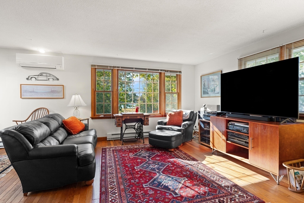 109 Riverview Road Gloucester, MA 01930 - Photo 5 of 42 a living room with furniture and a flat screen tv