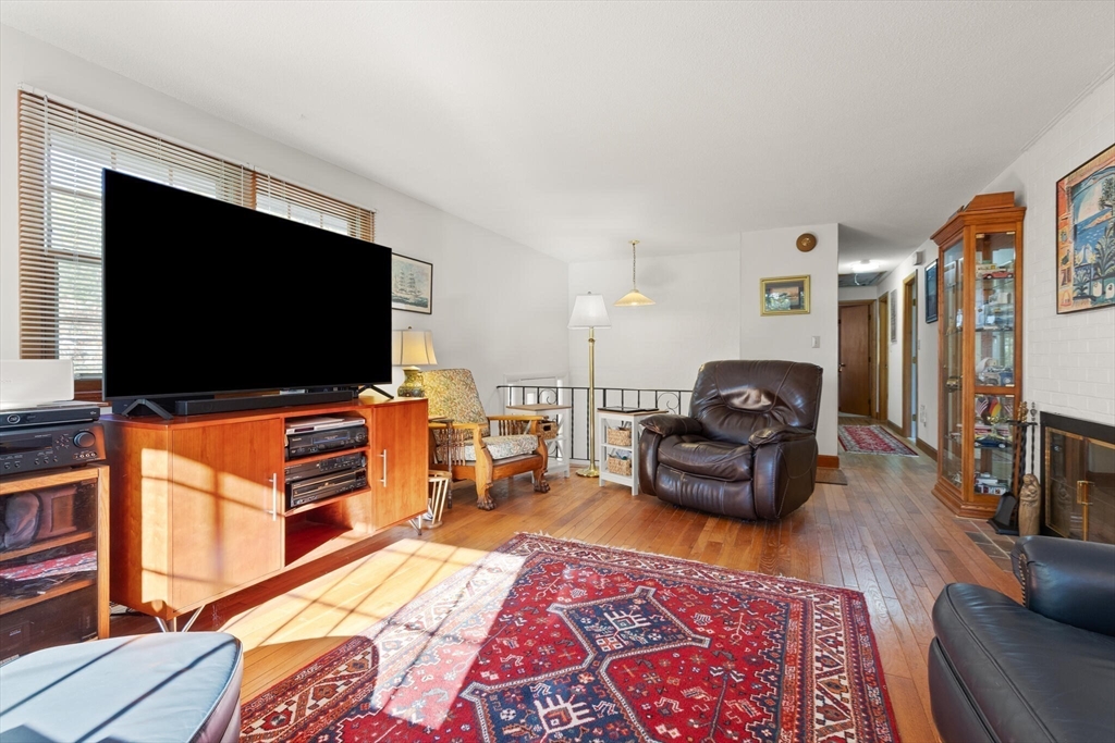 109 Riverview Road Gloucester, MA 01930 - Photo 8 of 42 a living room with furniture and a flat screen tv