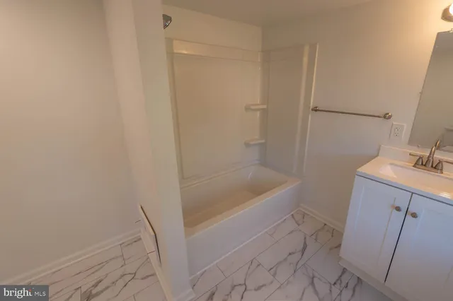 a bathroom with a bathtub sink and toilet