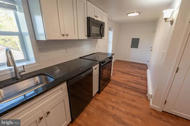 a kitchen with a stove and a microwave
