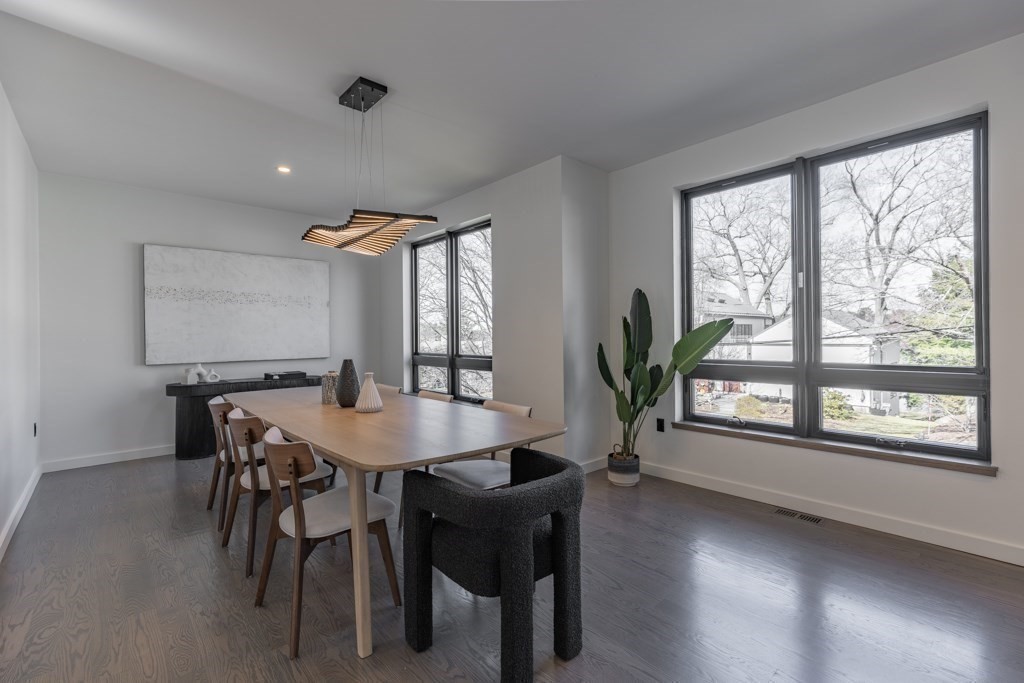 46 Beverly Road Arlington, MA 02474 - Photo 13 of 42 a view of a dining room with furniture and a potted plant