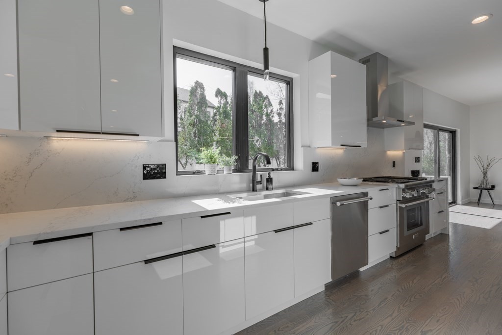 46 Beverly Road Arlington, MA 02474 - Photo 19 of 42 a kitchen with a sink stove and cabinets