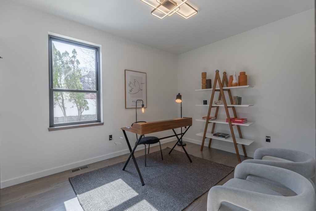 46 Beverly Road Arlington, MA 02474 - Photo 20 of 42 a living room with furniture and a window