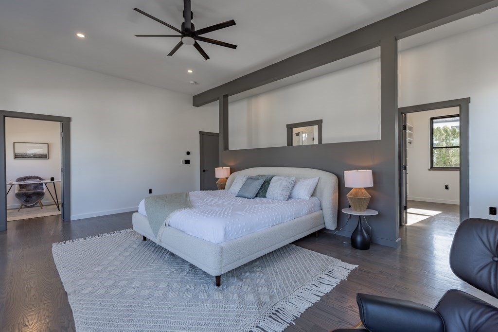 46 Beverly Road Arlington, MA 02474 - Photo 24 of 42 a spacious bedroom with a bed couch chandelier and a window