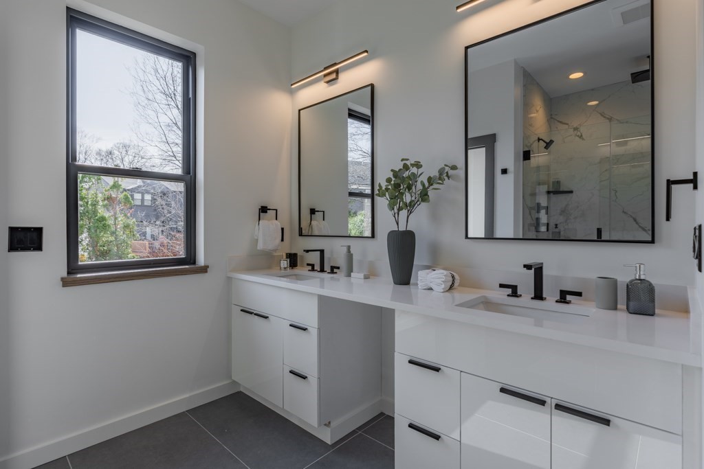 46 Beverly Road Arlington, MA 02474 - Photo 25 of 42 a bathroom with a double vanity sink window and mirror