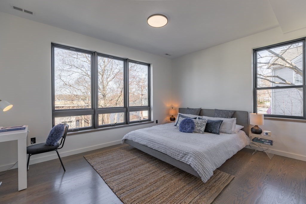 46 Beverly Road Arlington, MA 02474 - Photo 30 of 42 a bedroom with a large bed and a large window