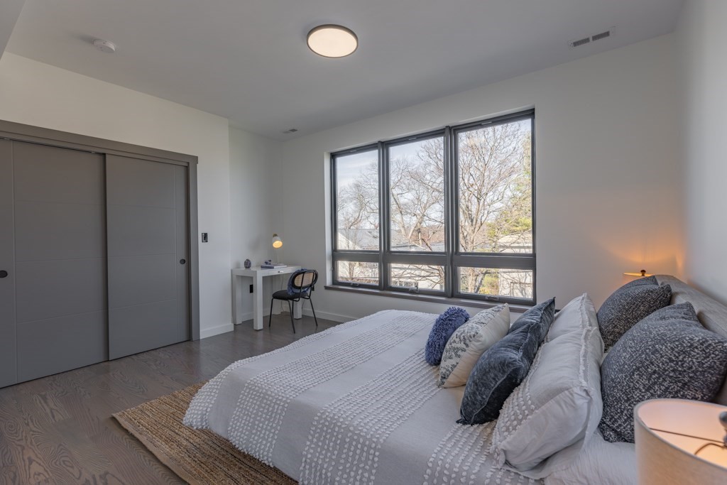 46 Beverly Road Arlington, MA 02474 - Photo 31 of 42 a bedroom with a bed and a large window