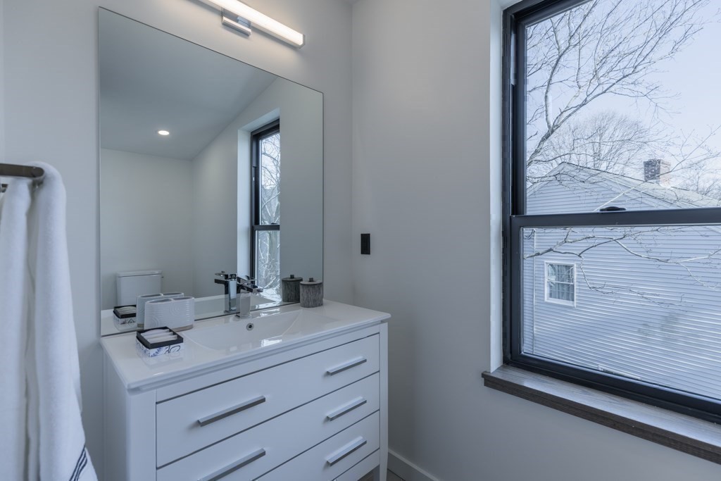 46 Beverly Road Arlington, MA 02474 - Photo 37 of 42 a bathroom with a sink mirror and vanity