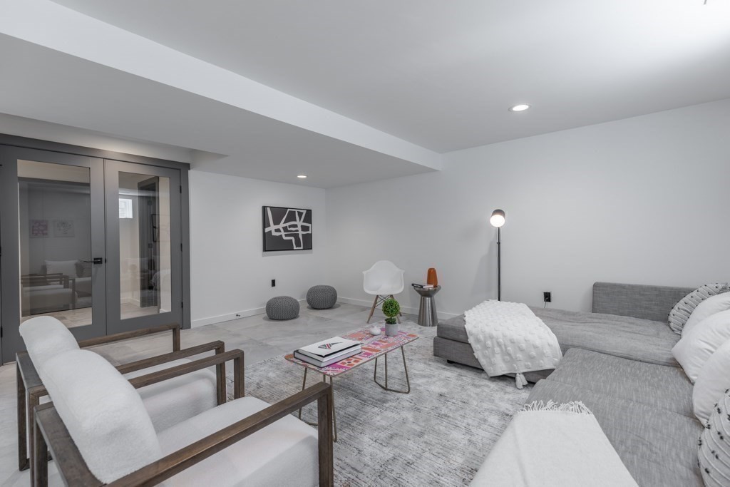 46 Beverly Road Arlington, MA 02474 - Photo 41 of 42 a living room with furniture and wooden floor