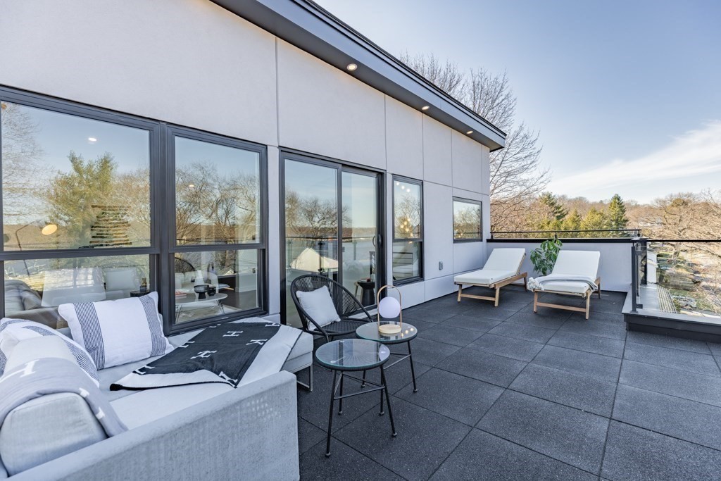 46 Beverly Road Arlington, MA 02474 - Photo 5 of 42 a living room with furniture and a floor to ceiling window