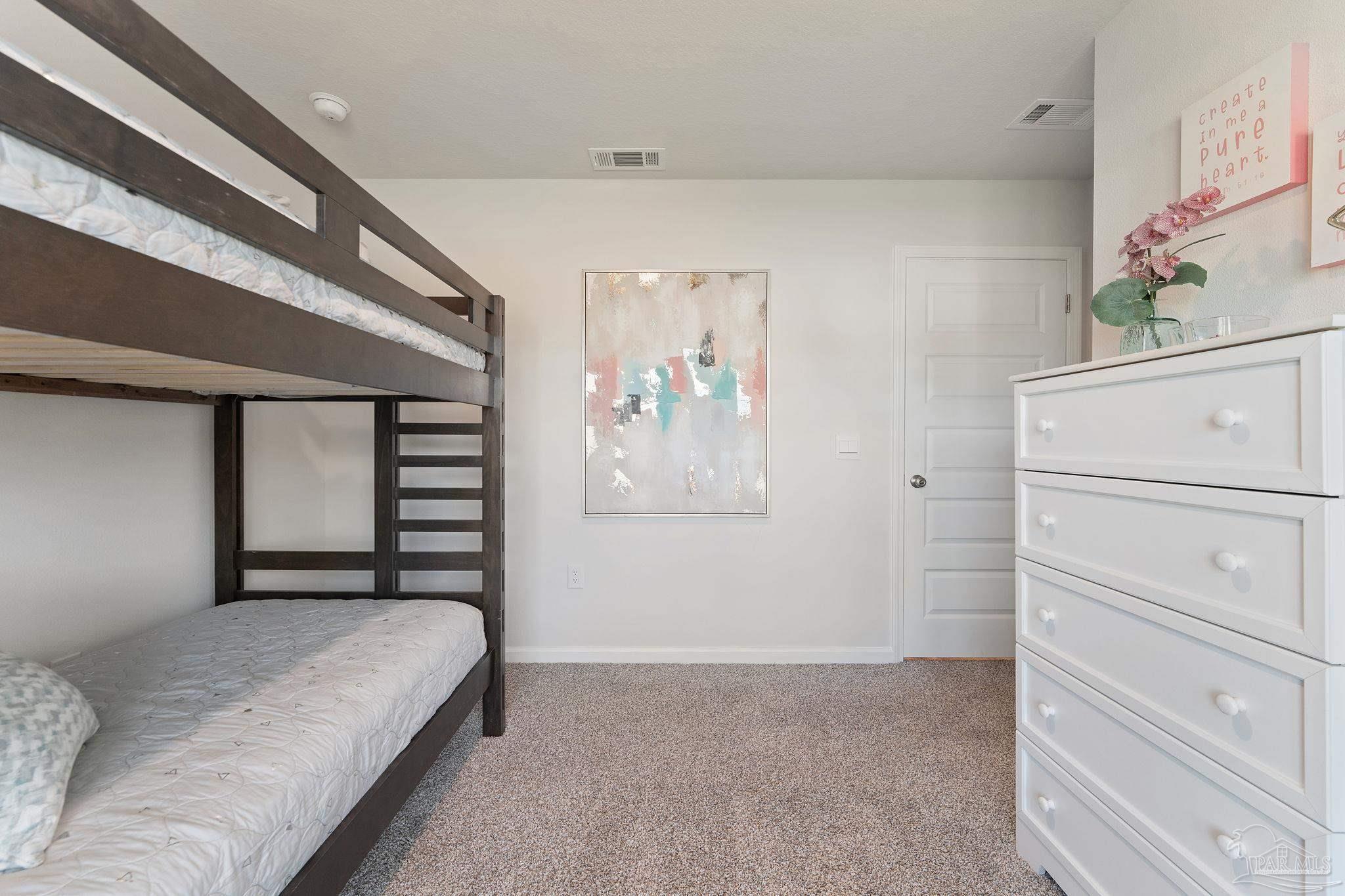 4884 Canvasback Boulevard Pace, FL 32571 - Photo 5 of 22 a bedroom with a bed and a window