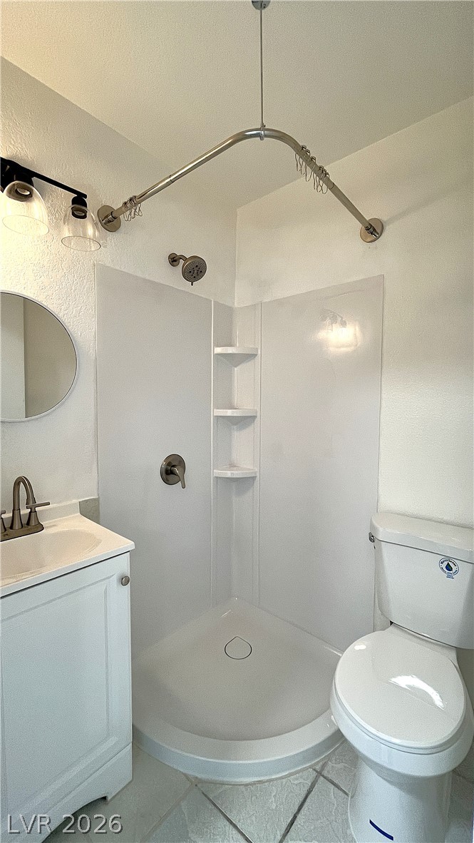 6750 Del Rey Avenue, Unit 123 Las Vegas, NV 89146 - Photo 10 of 21 A well-appointed bath features a walk-in shower and a stylish vanity.