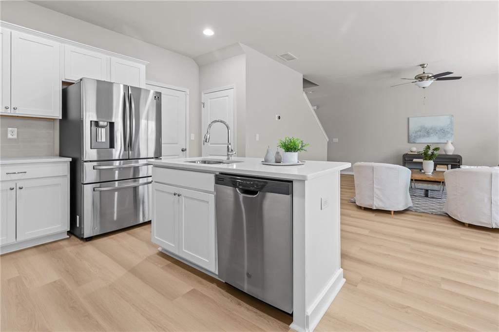 325 Winston Circle Canton, GA 30114 - Photo 15 of 38 a kitchen with stainless steel appliances a sink and a refrigerator