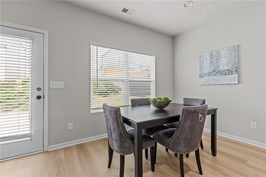 325 Winston Circle Canton, GA 30114 - Photo 17 of 38 a view of a dining room with furniture window and wooden floor