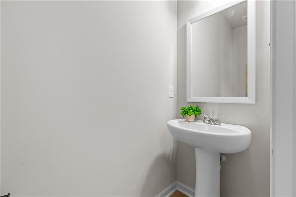 325 Winston Circle Canton, GA 30114 - Photo 19 of 38 a bathroom with a sink and mirror