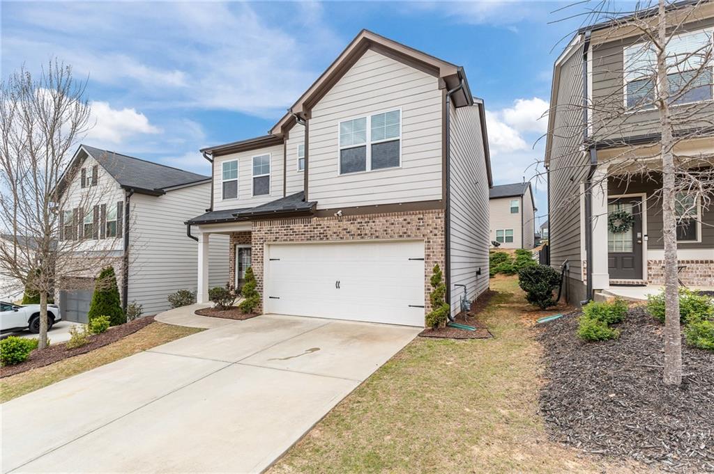 325 Winston Circle Canton, GA 30114 - Photo 2 of 38 a view of a house with a yard