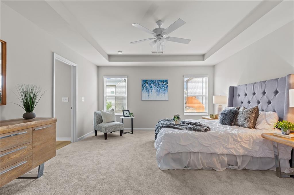 325 Winston Circle Canton, GA 30114 - Photo 21 of 38 a bedroom with a bed and a chandelier