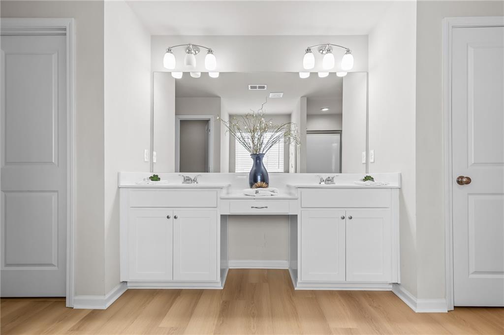 325 Winston Circle Canton, GA 30114 - Photo 24 of 38 a bathroom with a sink vanity and a mirror
