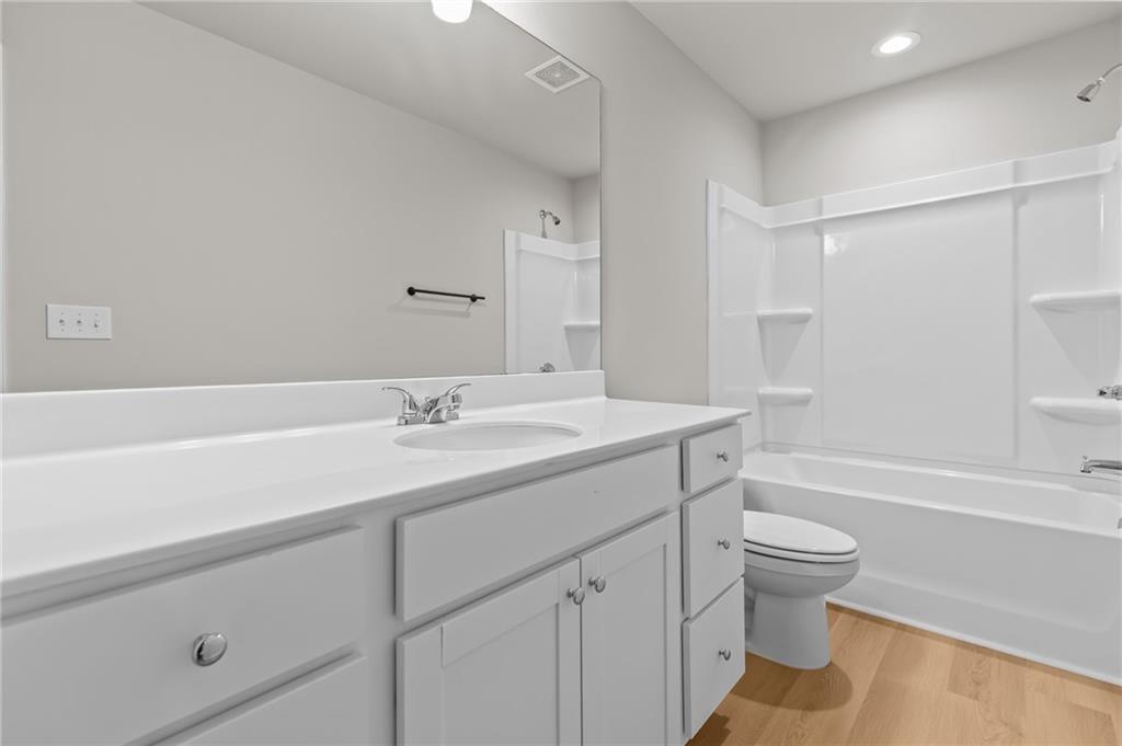 325 Winston Circle Canton, GA 30114 - Photo 30 of 38 a bathroom with a sink a toilet and a bathtub
