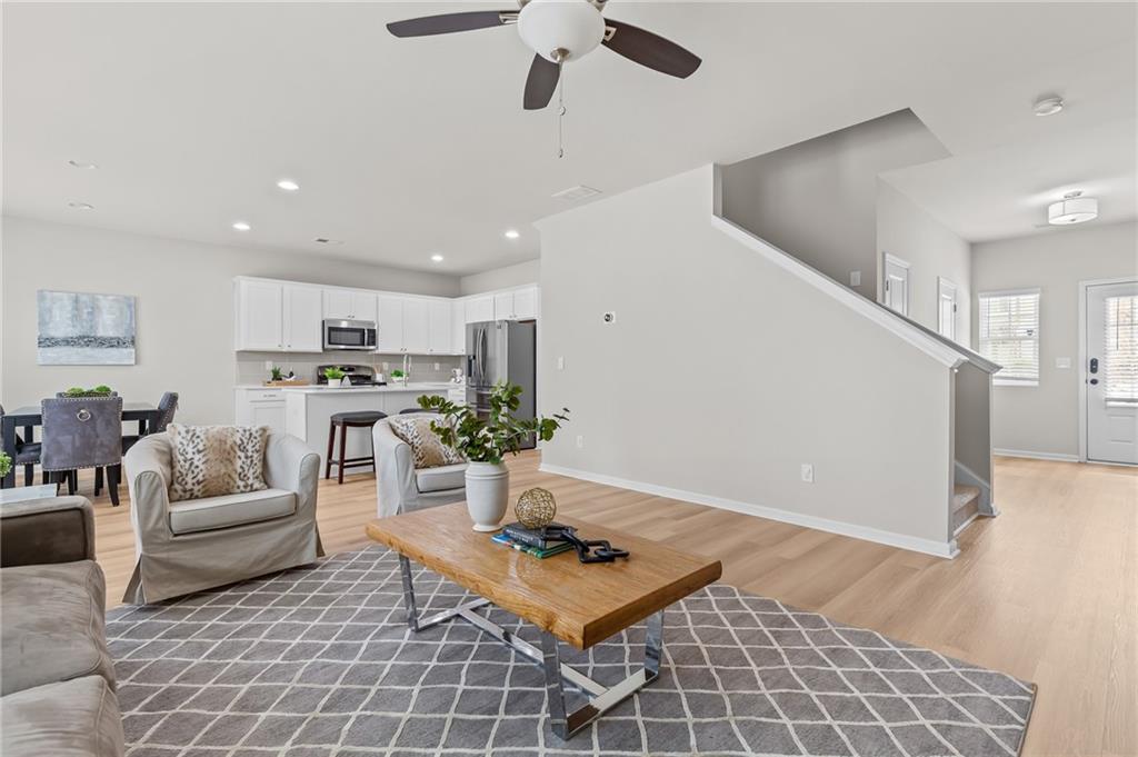 325 Winston Circle Canton, GA 30114 - Photo 7 of 38 a living room with lots of furniture and kitchen view