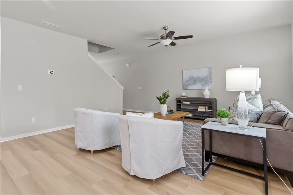 325 Winston Circle Canton, GA 30114 - Photo 9 of 38 a living room with furniture and a wooden floor