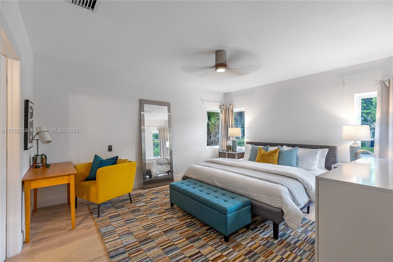 1757 Daytonia Road Miami Beach, FL 33141 - Photo 11 of 30 a bedroom with a bed a dresser and potted plant on the dresser