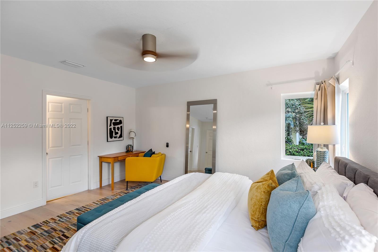 1757 Daytonia Road Miami Beach, FL 33141 - Photo 12 of 30 a bedroom with a bed and wooden floor