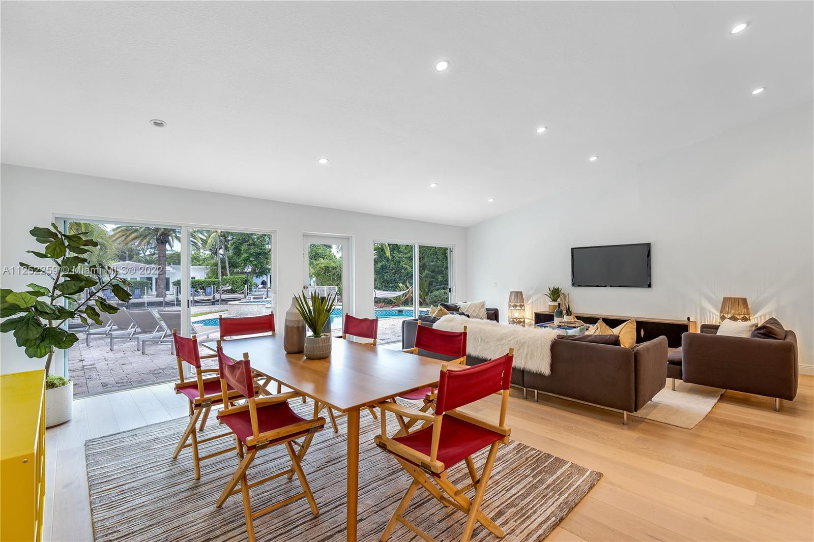 1757 Daytonia Road Miami Beach, FL 33141 - Photo 18 of 30 a living room with furniture and a large window